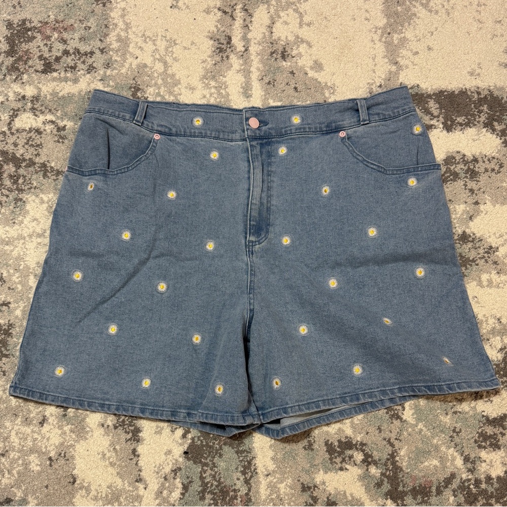 Chic Women's Daisy Duck Denim Shorts with Yellow Floral Details